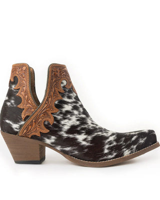 Black and white cowhide boot with brown leather accents on a white background