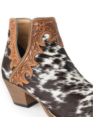 Cowhide leather boot with intricate brown tooled design on a white background