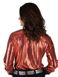 Woman wearing a rust metallic long sleeve zip top with turquoise collar and cuffs