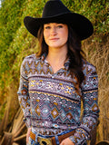 Woman wearing a colorful geometric print long sleeve button up shirt.