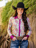 Woman wearing a colorful paisley button-up shirt with hot pink foil trim