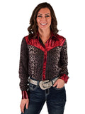 Woman wearing a gray leopard print long sleeve button up shirt with red satin accents