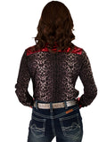 Woman wearing a gray leopard print long sleeve button up shirt with red satin accents