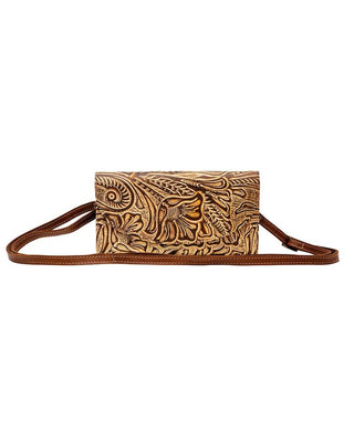 A brown leather crossbody bag with an embossed floral and paisley pattern on the front, featuring a matching adjustable leather strap, shown against a plain white background.