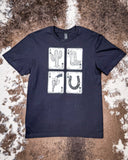 The Four Aces Graphic Tee displayed on cowhide.