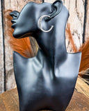 earrings on a mannequin