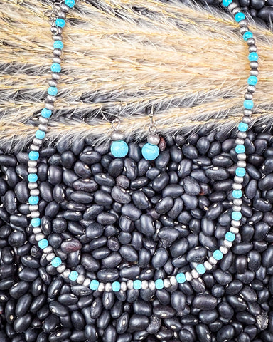 Blue River Fashion Choker Necklace Set on back pebbles and wheat.