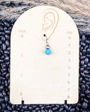Blue River Fashion Choker earrings on wooden measurements.