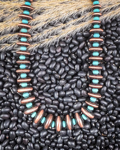 necklace on beans and wheat