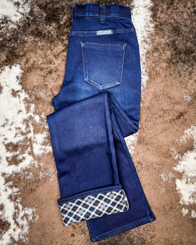 Denim Jeans on cowhide rug