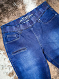 Denim Jeans on cowhide rug