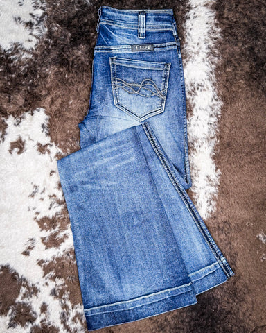 The Dare Me Trouser Jeans displayed on cowhide.
