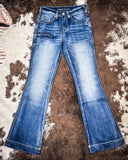 The Dare Me Trouser Jeans displayed on cowhide.