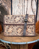 Purse displayed on wooden table.