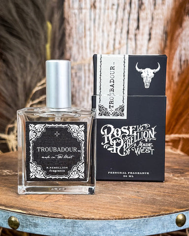 Troubadour Cologne displayed on table.