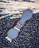 Apple Watch Fashion Band - Bone and Bloom displayed on black pebbled.