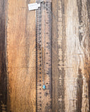 Necklace being displayed with ruler.