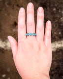 Hachi Adjustable Genuine Turquoise Ring being displayed on hand.