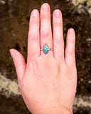 Turquoise Ring shown on hand.