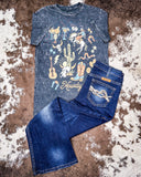 Black graphic t-shirt and jeans on a textured surface