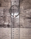 Hoop earring on a wooden surface with a ruler for scale