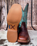Turquoise and brown cowboy boots on a textured surface