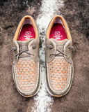 Pair of Twisted X shoes with woven pattern on a textured surface