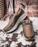 Pair of brown casual shoes with woven pattern on a textured surface