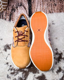 Twisted X Feather X sneaker on a textured background