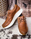 Twisted X Feather X sneaker on a wood background