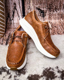 Twisted X Feather X sneaker on a wood background