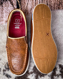 Brown leather shoe with embossed design and Twisted X branding on a textured surface.