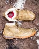 Twisted X shearling lined mocs on a textured surface.