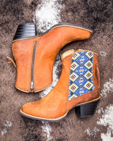 Wrangler Free Spirit Bootie on a textured background