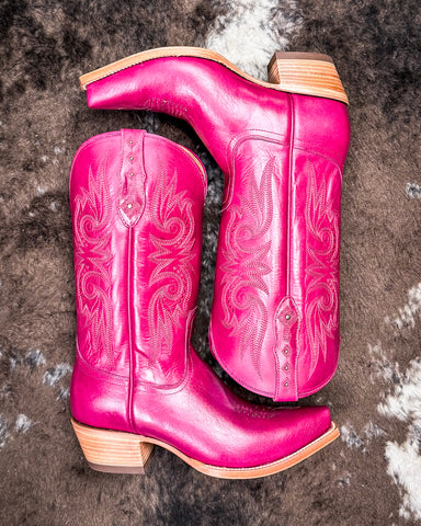 Western Boots on cowhide rug 