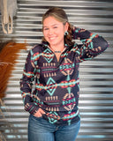 Cabin Fever Pullover being modeled and styled on a person in front of metal background.