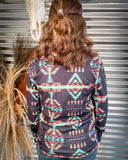 Cabin Fever Pullover being modeled and styled on a person in front of metal background.