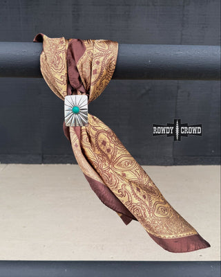 Decorative scarf with a brooch on a black background