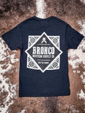 Full view of black Havasu Tee back design with bold Bronco logo and diamond-patterned corners.
