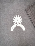 Close-up of white spur graphic on chest of black Havasu Tee shirt.