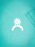 Close-up of white Bronco sun and horseshoe logo on teal t-shirt fabric