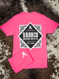Back of neon pink Bronco tee with large western-inspired Bronco Supply Co. print