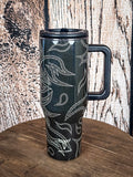 Handled tumbler with flame stitch design.

