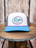 Front view of Rope Like a Girl Hooey hat on a wood background