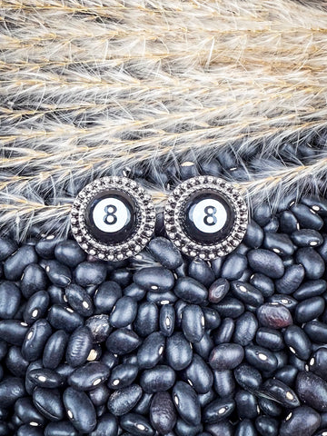 Earrings shown on beans and wheat