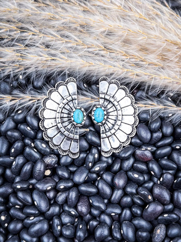 Earrings shown on beans and wheat