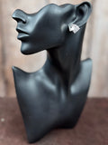 Mannequin wearing earring for size