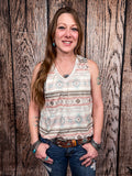 Model wearing tank top standing in front of a wood background.