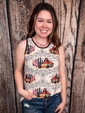 Model wearing tank top standing in front of a wood background.