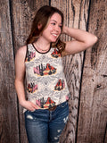Model wearing tank top standing in front of a wood background.